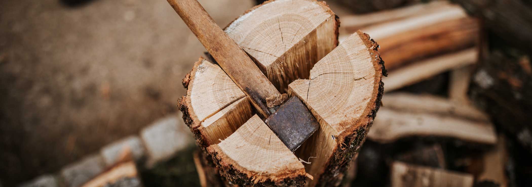 Firewood is split with an axe