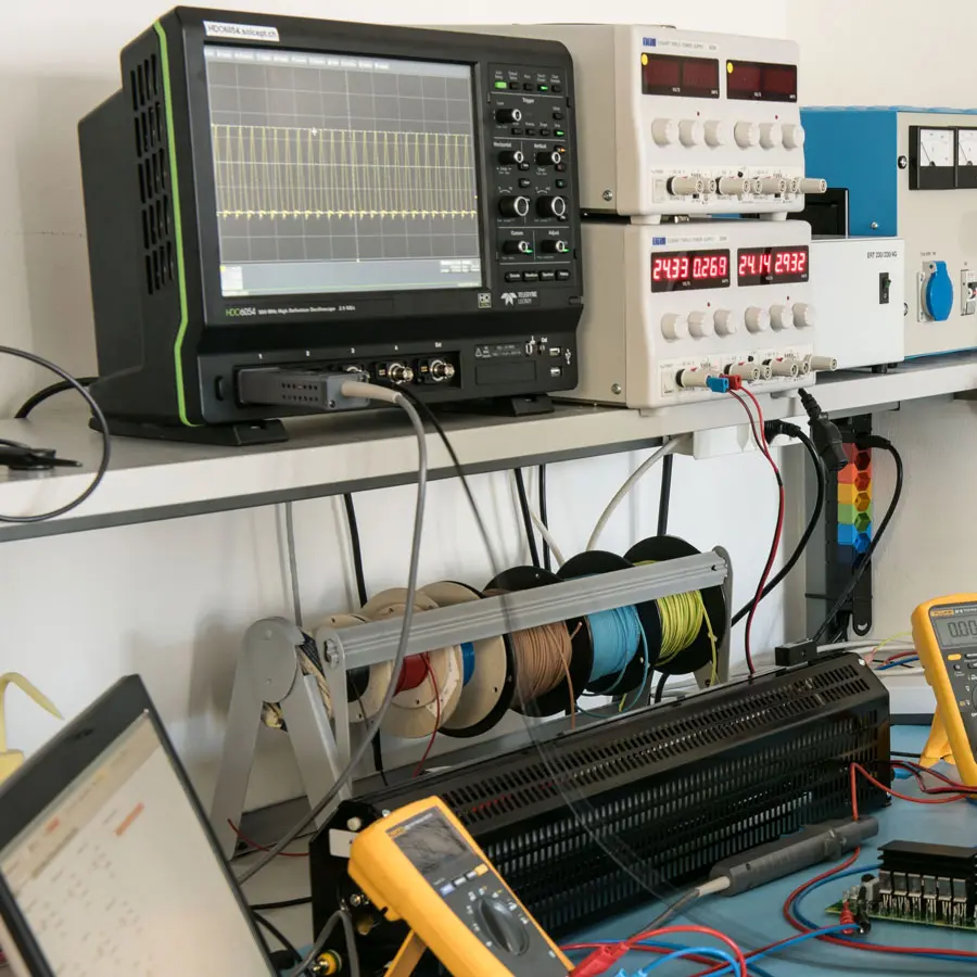 Experiment: engineer measuring an electronic circuit