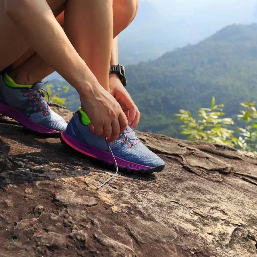Runner laces her shoes