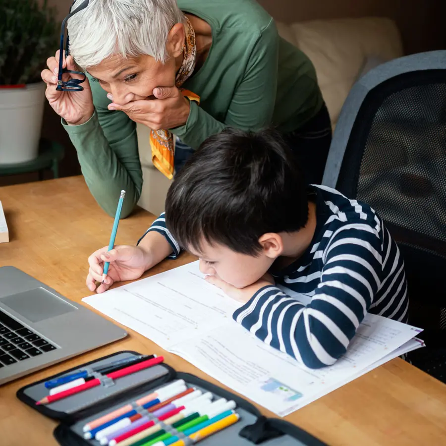 Grandmother and grandson doing homework