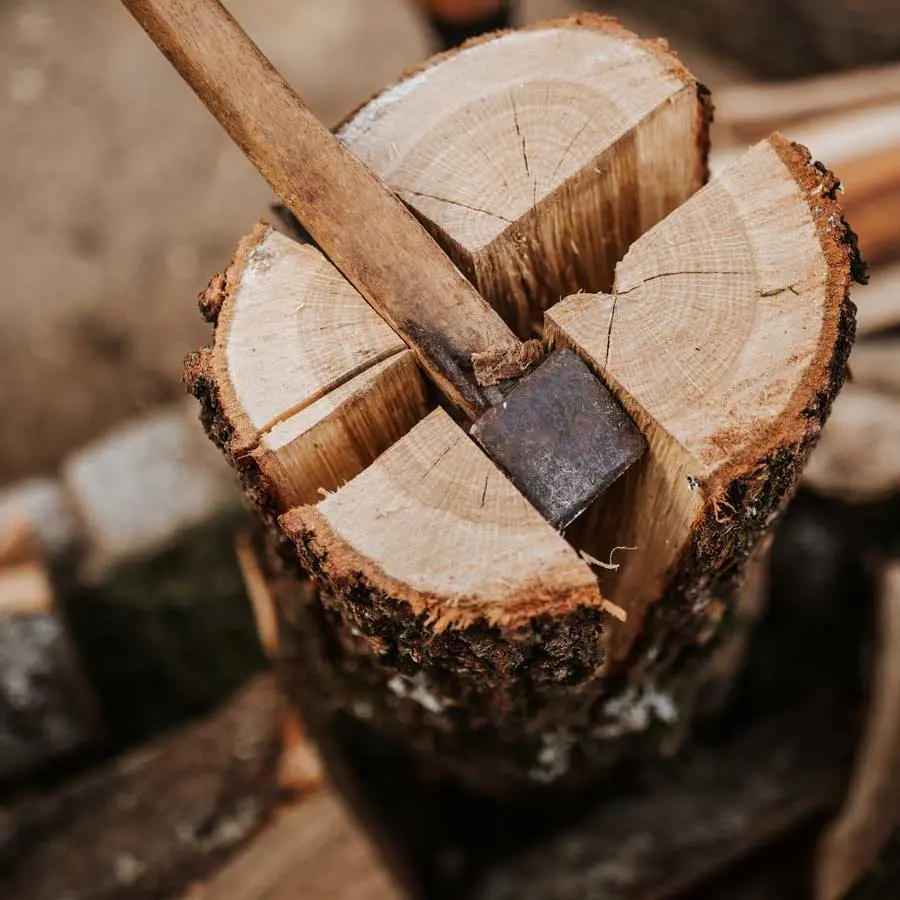 Fire wood is split with an axe