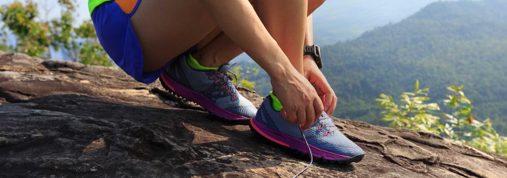 Runner laces her shoes