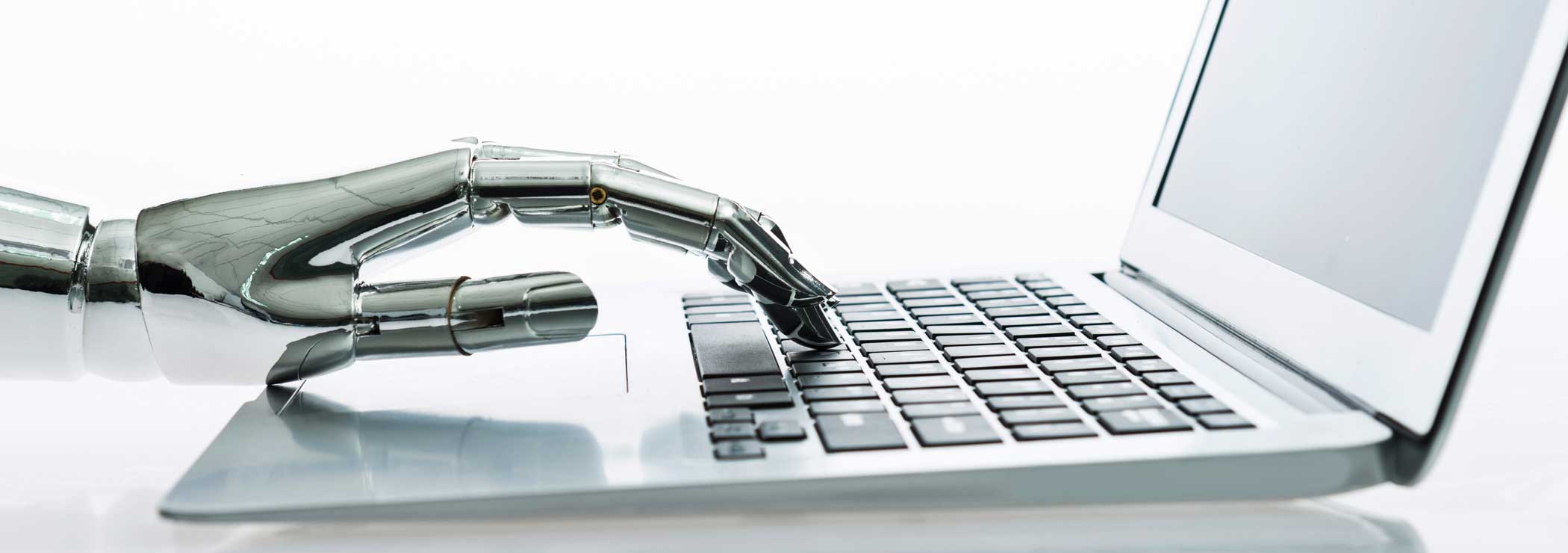 Roboter hand writes on keyboard