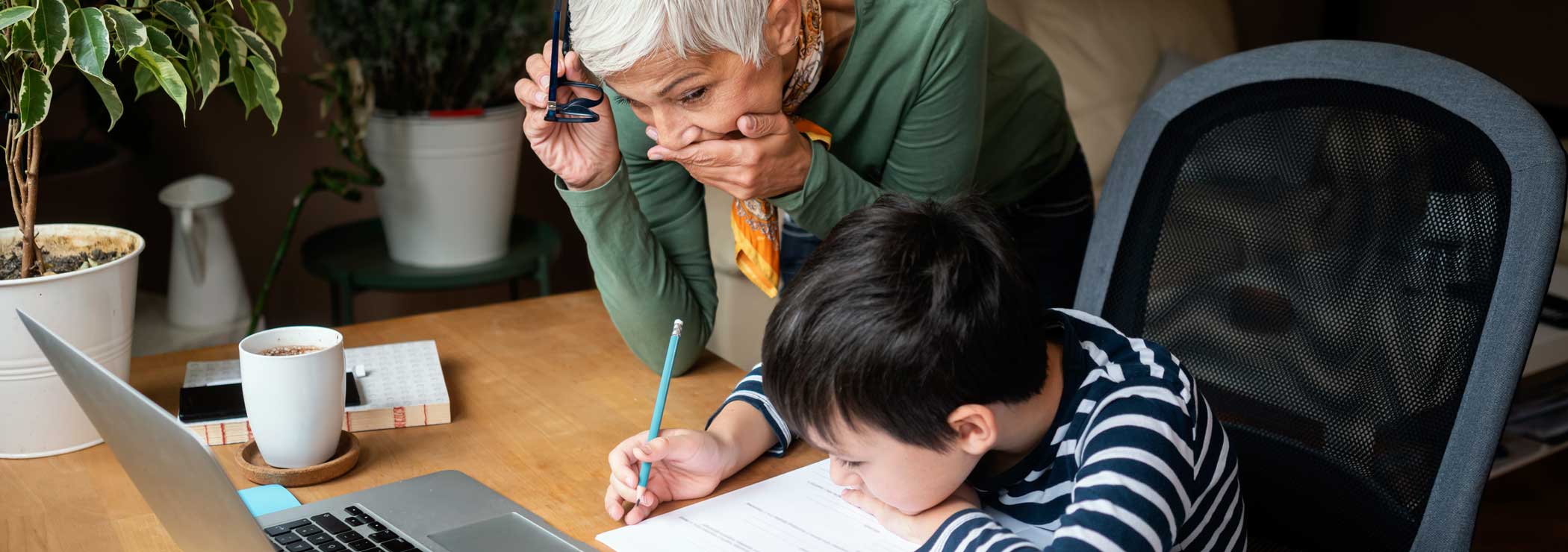 Grandmother and grandson doing homework