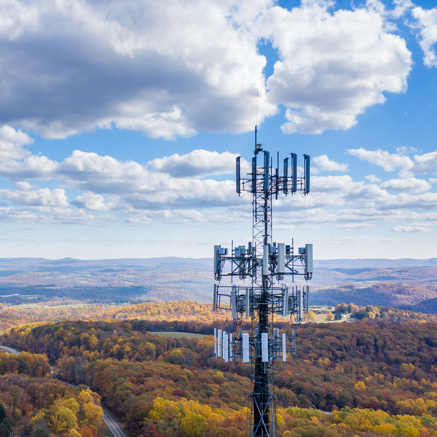 Communication tower with cloudy sky
