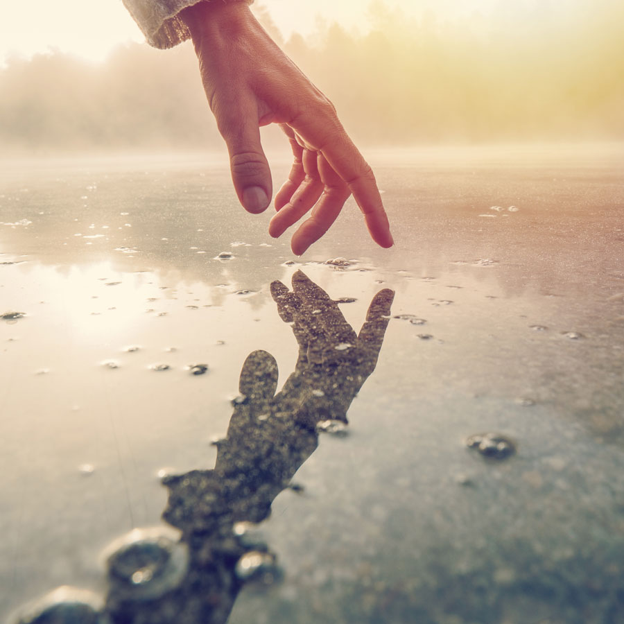 Hand touching water