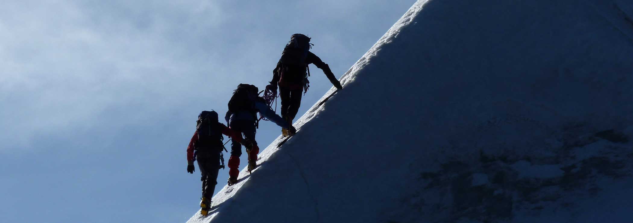 Three mountaineers on short rope