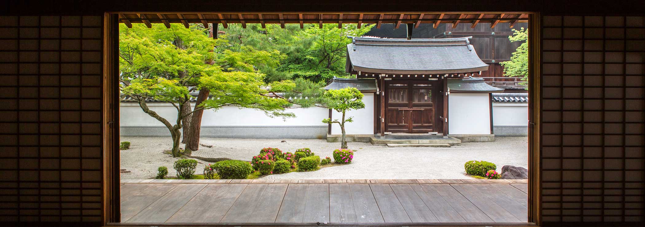 Zen garden seen through a temple door
